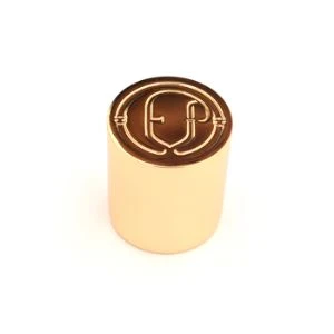 Cappuccio per profumo in metallo dorato